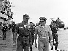 General William Westmoreland, Commander of Military Assistance Command, Vietnam, with Captain Paul J. Knapp (USN) and a pair of ARVN generals, aboard Princeton, November 1964. General William Westmoreland aboard USS Princeton (LPH-5), 14 November 1964 (NH 93798).jpg