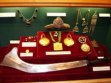 Objects on display with special mounts fabricated Gurkha Museum display case.JPG