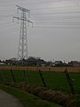 De 2 grote hoogpspanningslijnen zijn een vertrouwd zicht op Het Zwartland. Rechts van de mast wordt als 'vooraan' Het Zwartland beschouwt. Dit is het enige stuk van het gehucht dat binnen een woonzone ligt, hier staan de 6 eerste huizen op een rij.