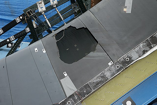 Pieces of reinforced carbon–carbon including a panel removed from the wing of Space Shuttle Atlantis, showing brittle failure of C/C due to foam impac