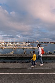 Jules and Gabriel walking alongside the marina, Ponta Delgada, São Miguel Island, Azores, Portugal