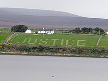 'Justice' (for the Rossport Five) mowed in Ros Dumhach hay field Justice for the Rossport 5.jpg