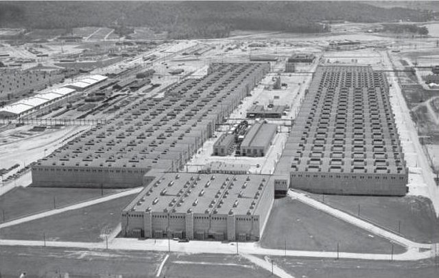 The K-25 building of the Oak Ridge Gaseous Diffusion Plant aerial view, looking southeast. The mile-long building, in the shape of a "U", was complete