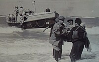 The Lifeboat lands an injured crewman from the Lucy Landing a rescued crewman from the Lucy August 1961.JPG