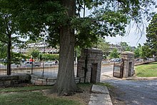 Looking northwest out the current main gates of the cemetery. The housing development beyond North Capitol Street was once cemetery land. Looking NW out main gate - Prospect Hill Cemetery - 2014.jpg