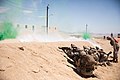 U.S. Marines with Company A, 1st Battalion, 5th Marine Regiment, 1st Marine Division, move through urban terrain during an integrated training exercise at Marine Corps Air Ground Combat Center Twentynine Palms, California, April 7, 2021. The Marines conducted military operations in urban terrain training simulation while integrating with amphibious combat vehicles to improve their capabilities. (U.S. Marine Corps photo by Cpl. Jamin M. Powell)