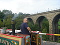 Working narrowboat on Marple Aqueduct, with the viaduct to the north