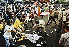 Trisakti University students clash with police forces during the Indonesian riots of May 1998. May 1998 Trisakti incident.jpg