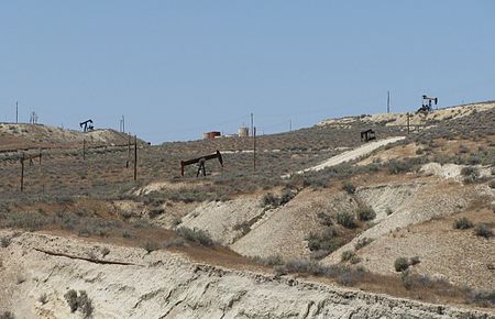 Oil wells and piping on the McKittrick Field, about a mile west of the town of McKittrick. McKittrickField.jpg