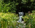 Image 838Naked Woman statue (1933) by Ruy Gameiro (1907-1935) with plants in the foreground, Jardim da Fundação Calouste Gulbenkian, Lisbon, Portugal