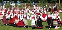 Women in traditional Saaremaa dress performing a folk dance