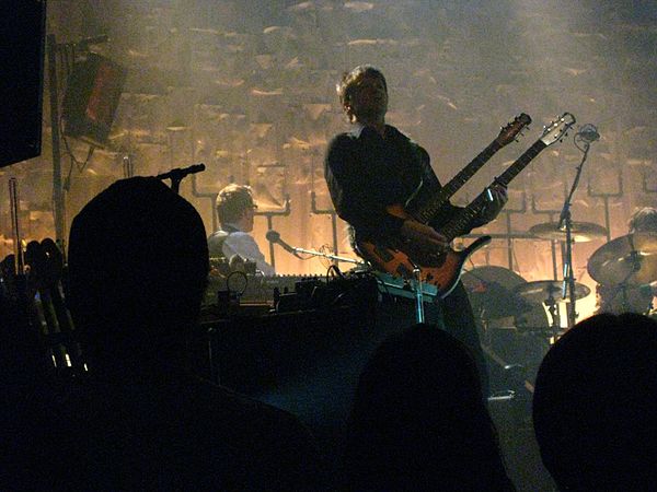 Cline playing a double-necked guitar with Wilco in 2010