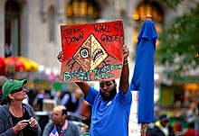 Man protesting with sign at Occupy Wall Street. 17 October 2011 Occupy Wall Street.jpg