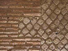 Example of opus mixtum comprising opus reticulatum edged with opus latericium in the Roman theatre, Naples, Italy Opus compositum, roman theatre, naples.jpg