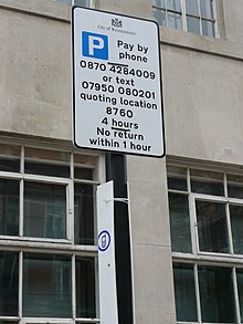 A sign telling people that they must pay for parking by telephone. Seen in the Westminster area of London. Pay By Telephone Sign1.JPG