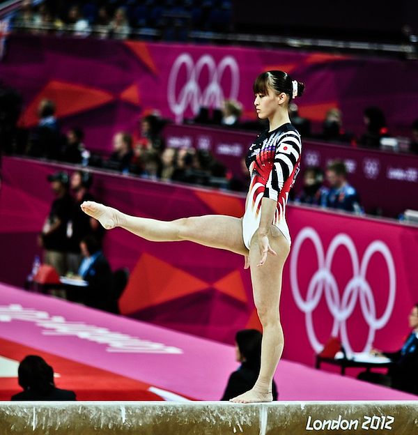 Rie Tankaka performs the balance beam in women's all-around.