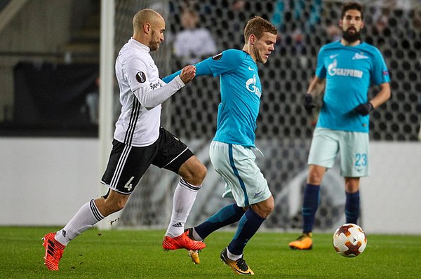 Reginiussen chasing a ball with Zenit Saint Petersburg's player Oleg Shatov in the UEFA Europa League match in November 2017.