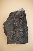 Stele of the Akkadian king Naram-Sin. The "-ra-am" and "-sin" parts of the name "Naram-Sin" appear in the broken top right corner of the inscription, traditionally reserved for the name of the ruler. Istanbul Archaeological Museum.