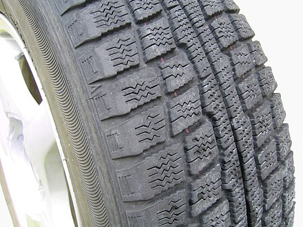 A winter tire without studs, showing tread pattern designed to compact snow in the gaps.[22]