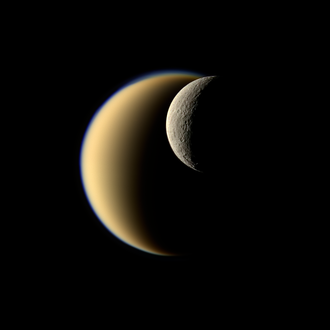 Titan (larger crescent) and Rhea (smaller crescent), two regular moons of Saturn Titan and Rhea - November 19 2009.png