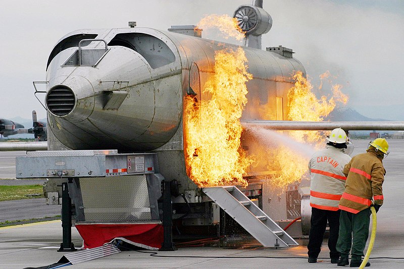 File:US Navy 040303-N-5821W-001 Personnel at NAS Sigonella's Fire Department battle a fire while training with the a Mobile Aircraft Fire Trainer (MAFT).jpg