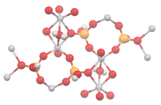 Portion of the crystal structure of VO(HPO4) 0.5H2O. The vanadium is octahedrally coordinated and phosphorus is tetrahedral. Water is a bridging ligand. Color code: red = O; gray = V, H; ochre = P. VO(HPO4)0.5H2O.tif