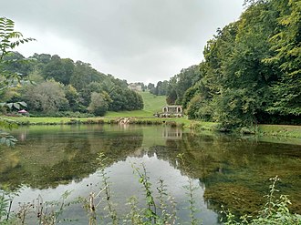 View of the Palladian Bridge (middle distance) and Prior Park College (far distance) View across Prior Park, Bath, England arp.jpg