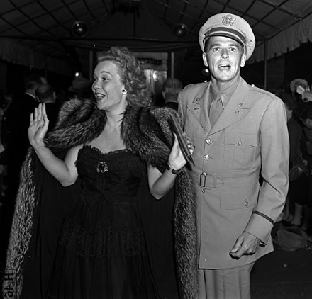 25-year-old Wyman with husband and fellow actor Ronald Reagan at the premiere of Tales of Manhattan in Los Angeles in August 1942. This was almost two years after the birth of their daughter Maureen. 31-year-old Army Air Force Second Lieutenant Reagan was assigned to Culver City's First Motion Picture Unit (18th AAF Base Unit) at this time, which was some three months after his voluntary transfer from the Army Cavalry, and five years after having been commissioned from the enlisted ranks of the U.S. Army Reserve in Iowa. Wyman was already a 10-year Hollywood veteran.