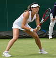 Yang Zhaoxuan competing in the first round of the 2015 Wimbledon Qualifying Tournament at the Bank of England Sports Grounds in Roehampton, England. The winners of three rounds of competition qualify for the main draw of Wimbledon the following week.
