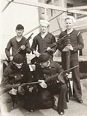 Yangtze Patrol sailors on the river gunboat USS Luzon in 1932, armed with a Winchester Model 1897 shotgun, Model 1928 Thompson submachine guns with L drum magazines, a Model 1918 Browning Automatic Rifle, and a Model 1917 Lewis Mark IV machine gun Yangtze Patrol Sailors Machineguns.jpg