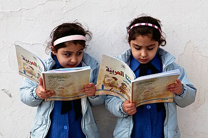 Young girls reading in a government primary school in Amman, Jordan.