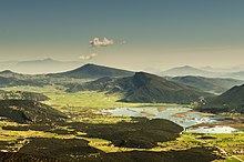 Karst closed depression with permanent lake Stymfalia, Peloponnese, Greece. Seasonal abundant precipitation drained by 3 sinkholes Limne Stumphalias.jpg