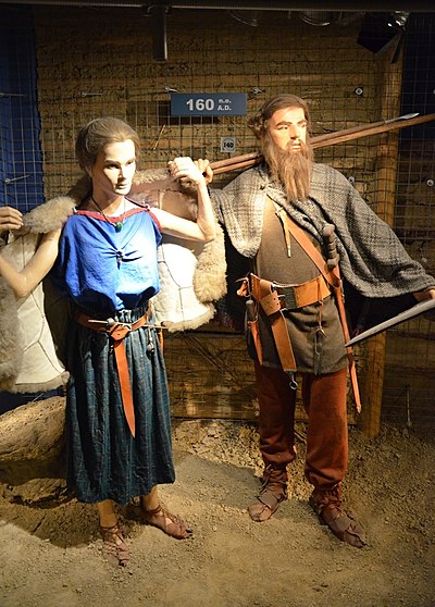 Reconstruction of the garments of the Vandalic couple, with the male having his hair in a "Suebian knot" (160 AD), Archaeological Museum of Kraków, Poland.