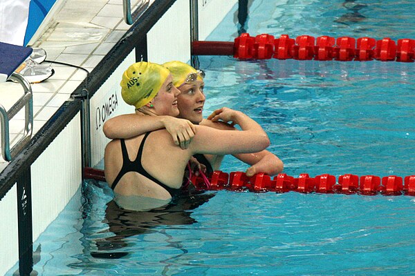 Cole and Annabelle Williams embrace at the end of the S9 100m butterfly final at the 2008 Beijing Paralympic Games