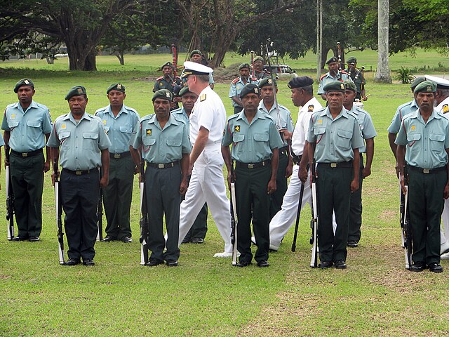 Admiral Patrick Walsh, commander of the U.S. Pacific Fleet, reviews a Papua New Guinea Defence Force Honor guard
