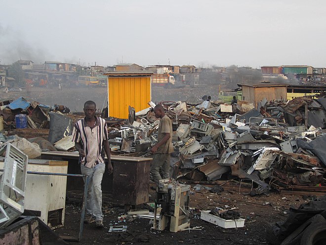 Low-income workers in Ghana recycling waste from high-income countries, with recycling conditions heavily polluting the Agbogbloshie area.
