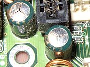 Failed Tayeh capacitors which have vented subtly through their aluminium tops
