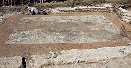 The mosaic revealed, as an archaeologist continues work on the walls