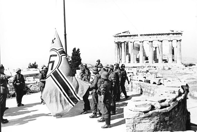 German soldiers raising a Third Reich battle flag on the Acropolis, Athens, 1941