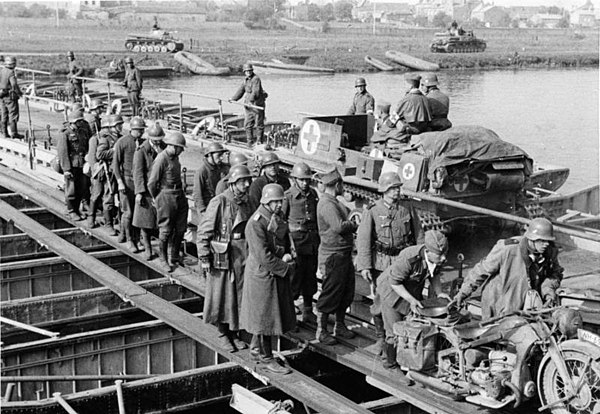 German troops with French prisoners crossing the Meuse on 15 May 1940 near Sedan