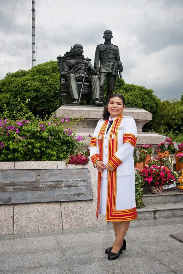 A doctoral graduate (PhD) of Chulalongkorn University in Thailand, dressed in an academic gown for her graduation ceremony