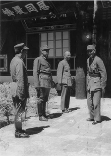 General Chiang Kai-shek (right) meets with Hui commanders Gen. Ma Bufang (second from left) and Gen. Ma Buqing (first from left) in Xining in August 1942. Chiang Kai-shek on right Ma Buqing on left Ma Bufang second from left.png