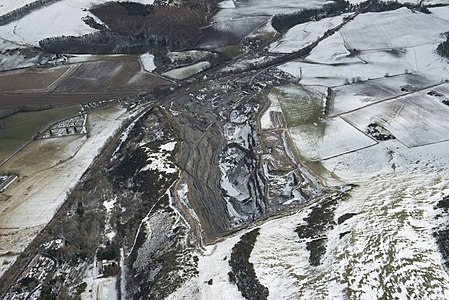 The site of the former Clatchard Craig fort, viewed from the west, in the early 21st century (RCAHMS) Clatchard Craig Aerial RCHAMS.jpg