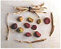 Dried kola nuts and chewing sticks harvested from C. acuminata