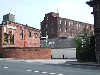 The first calico printing works was opened by Thomas Andrew downstream of the bridge. Compstall Mills 0161.JPG