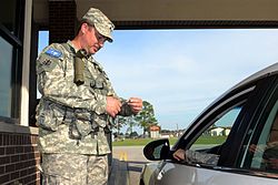 Cpl. Paul Herring, a security augmentee assigned to the 3rd Battalion, 1st Brigade of the South Carolina State Guard, guarding the front gate at McCrady Training Center, S.C. Cpl. Paul Herring, a security augmentee assigned to the 3rd Battalion, 1st Brigade of the South Carolina State Guard.jpg