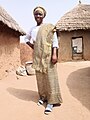 Dagomba woman dressed in a beautiful Kente dress in Northern Ghana