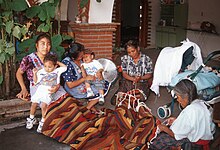 Bulmaro Perez Mendoza family finishing off a rug Family of Bulmaro Pe|urez Mendoza finishing off a tapete.jpg