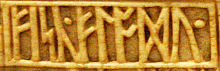 The inscription fisc.flodu. "Fisc Flodu ..." on the front of the Franks Casket alliterates on the F-rune f feoh, which connotes wealth or treasure Franks Casket front, words Fisc Flodu.jpg