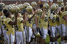 Tech celebrates after a win by singing the fight song with the student section. Georgia Tech football team Sept 9 2006.jpg